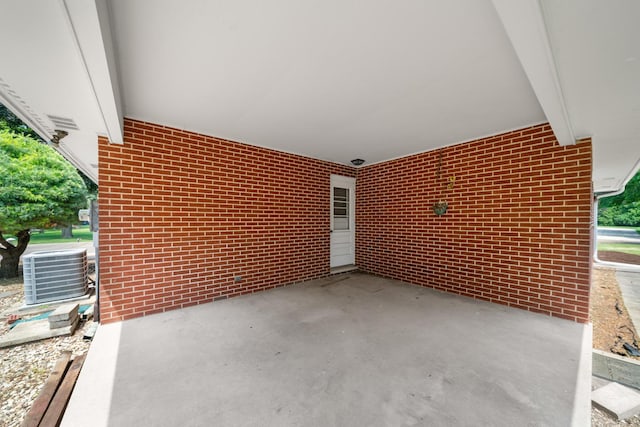 212 Forsythe Ln, Dekalb, IL 60115 - view of patio featuring a carport