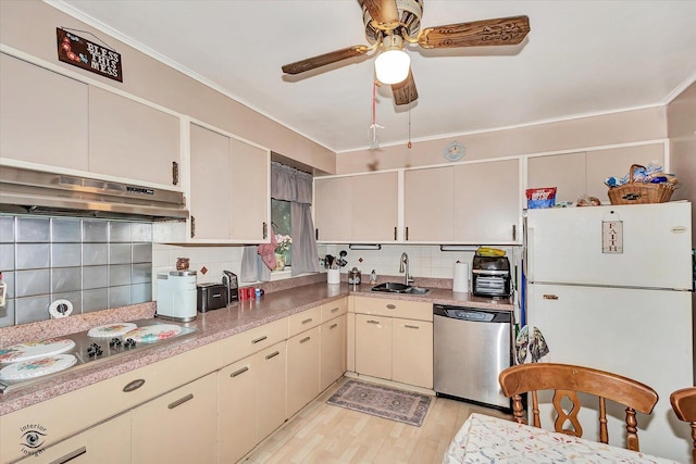 109 Wilson St, Park Forest, IL 60466 - kitchen with stainless steel dishwasher, freestanding refrigerator, electric stovetop, under cabinet range hood, and tasteful backsplash