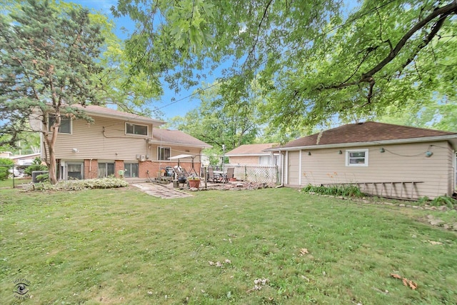 109 Wilson St, Park Forest, IL 60466 - fenced backyard with a patio area