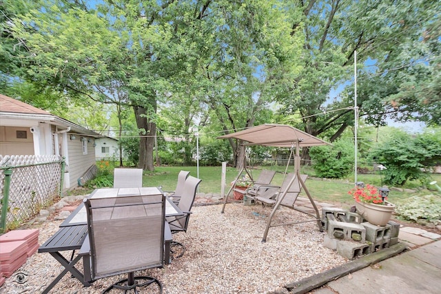 109 Wilson St, Park Forest, IL 60466 - view of patio with outdoor dining area, a playground, and view of wooded area