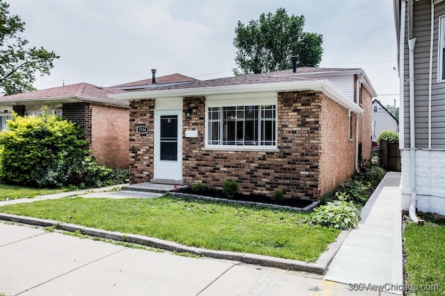 9154 S Luella Ave, Chicago, IL 60617 - view of front of home featuring brick siding and a front yard