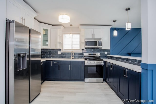 9154 S Luella Ave, Chicago, IL 60617 - kitchen with appliances with stainless steel finishes, light countertops, and white cabinets