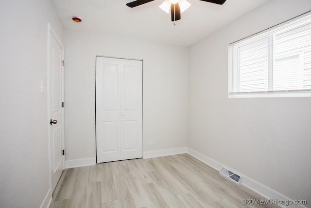 9154 S Luella Ave, Chicago, IL 60617 - unfurnished bedroom with light wood-style flooring, a closet, and ceiling fan