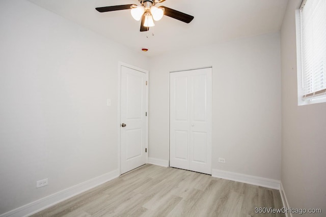 9154 S Luella Ave, Chicago, IL 60617 - unfurnished bedroom featuring light wood finished floors, a closet, and a ceiling fan