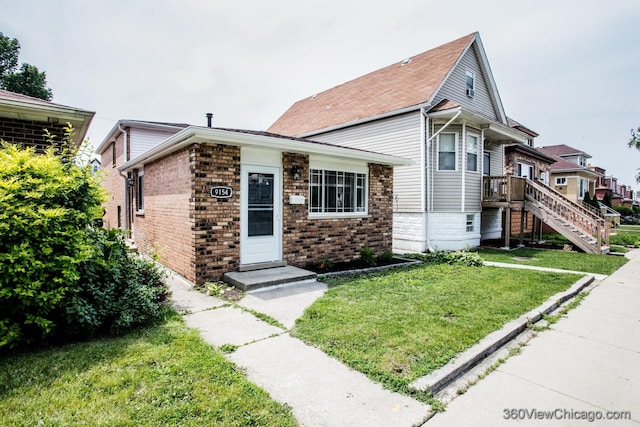 9154 S Luella Ave, Chicago, IL 60617 - view of front of house with brick siding and a front yard