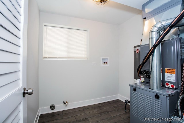 9154 S Luella Ave, Chicago, IL 60617 - laundry room with hookup for a washing machine, dark wood-style flooring, and heating unit