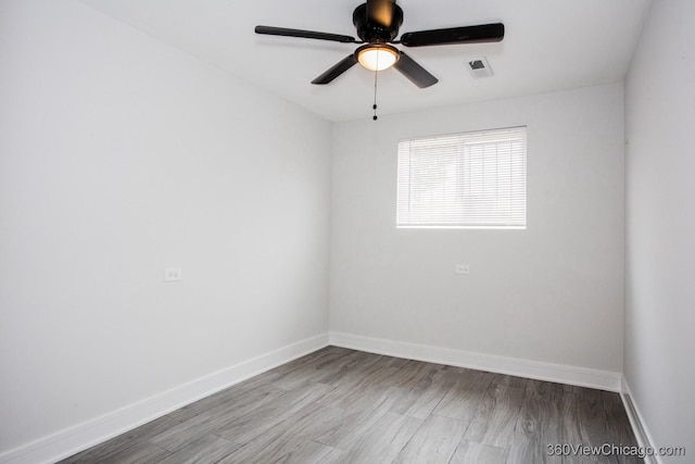 9154 S Luella Ave, Chicago, IL 60617 - spare room with ceiling fan and wood finished floors