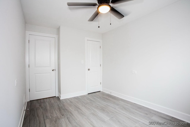 9154 S Luella Ave, Chicago, IL 60617 - unfurnished bedroom featuring light wood-style flooring and a ceiling fan