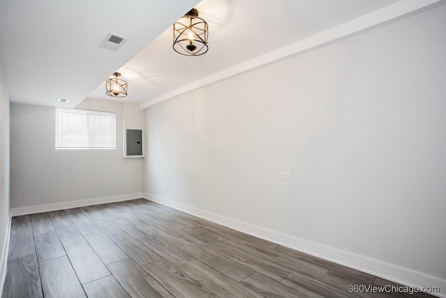 9154 S Luella Ave, Chicago, IL 60617 - empty room featuring electric panel and wood finished floors