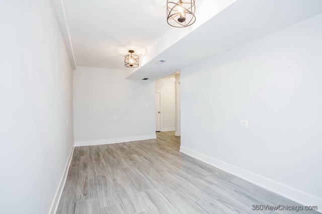 9154 S Luella Ave, Chicago, IL 60617 - spare room with baseboards and light wood finished floors