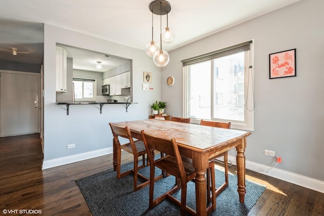 4248 N Keystone Ave Unit 2C, Chicago, IL 60641 - dining room with dark wood-style floors and baseboards