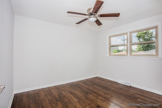 9206 S Yates Blvd, Chicago, IL 60617 - empty room featuring dark wood finished floors and ceiling fan
