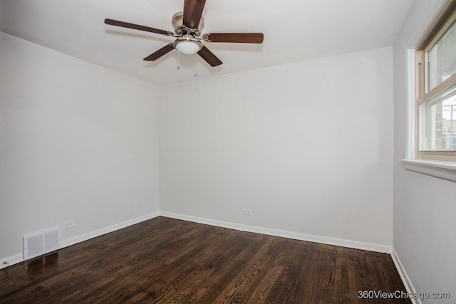 9206 S Yates Blvd, Chicago, IL 60617 - empty room featuring dark wood-style flooring and ceiling fan