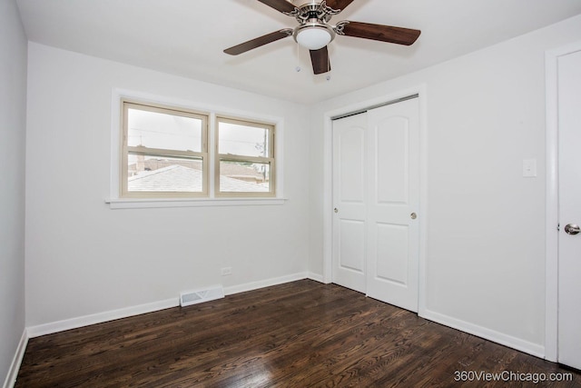 9206 S Yates Blvd, Chicago, IL 60617 - unfurnished bedroom featuring dark wood-style floors, a closet, and a ceiling fan