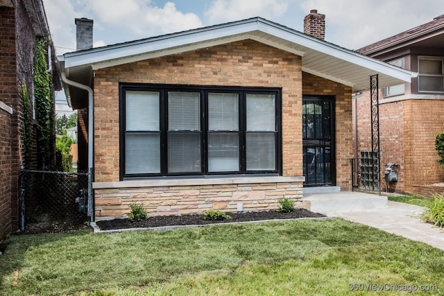 9206 S Yates Blvd, Chicago, IL 60617 - entrance to property with a chimney, stone siding, and brick siding