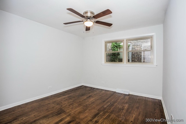 9206 S Yates Blvd, Chicago, IL 60617 - spare room featuring dark wood-style floors and a ceiling fan