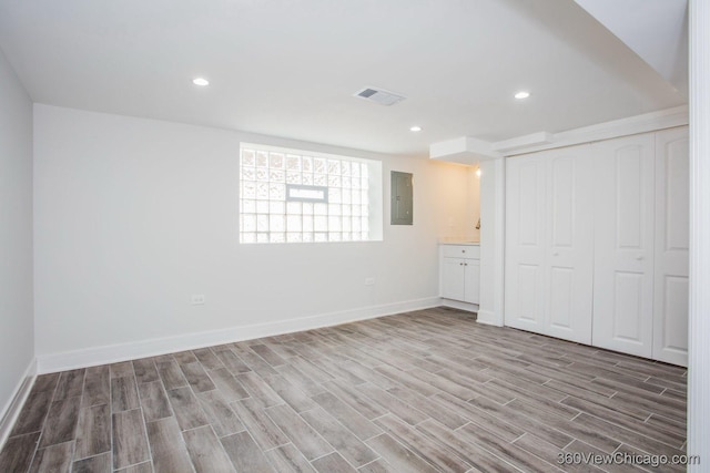 9206 S Yates Blvd, Chicago, IL 60617 - unfurnished bedroom with electric panel, wood finished floors, a closet, and recessed lighting