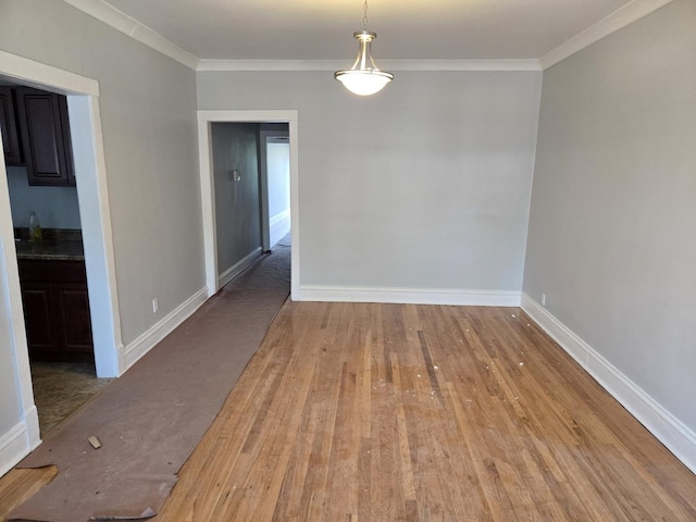 7543 S Yates Blvd, Chicago, IL 60649 - unfurnished dining area featuring crown molding and wood finished floors