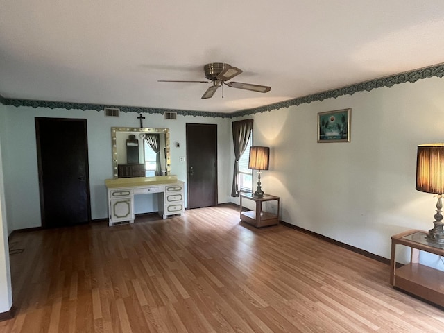 10S220 Hampshire Ln W, Willowbrook, IL 60527 - unfurnished living room with wood finished floors and a ceiling fan