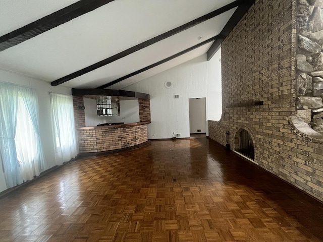 10S220 Hampshire Ln W, Willowbrook, IL 60527 - unfurnished living room featuring beam ceiling, a fireplace, high vaulted ceiling, and brick wall