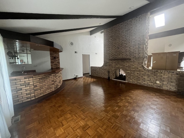 10S220 Hampshire Ln W, Willowbrook, IL 60527 - unfurnished living room with beam ceiling and high vaulted ceiling