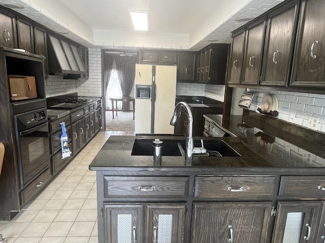 10S220 Hampshire Ln W, Willowbrook, IL 60527 - kitchen with black appliances, dark brown cabinets, tasteful backsplash, dark stone counters, and light tile patterned flooring