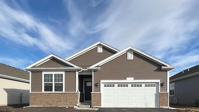2282 Elderberry Ct, Wonder Lake, IL 60097 - view of front of property with brick siding, driveway, and an attached garage