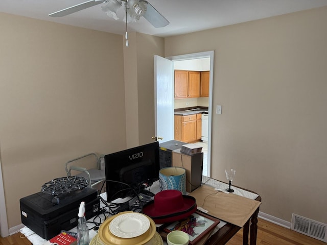 8114 S Anthony Ave, Chicago, IL 60617 - office area with ceiling fan and light wood-type flooring