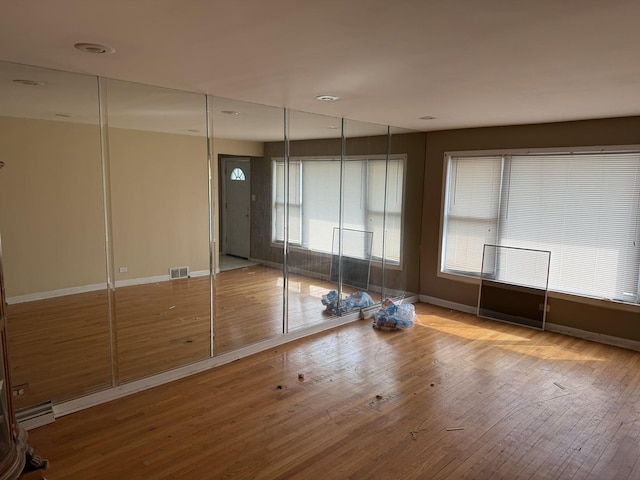 8114 S Anthony Ave, Chicago, IL 60617 - empty room with hardwood / wood-style floors and baseboards