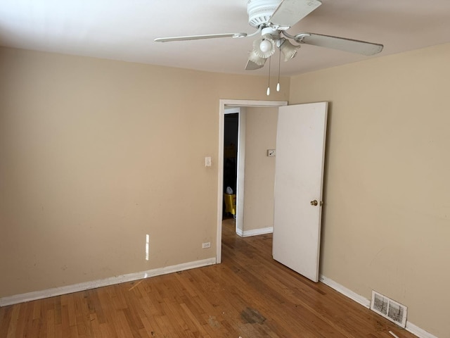8114 S Anthony Ave, Chicago, IL 60617 - spare room featuring wood finished floors and a ceiling fan