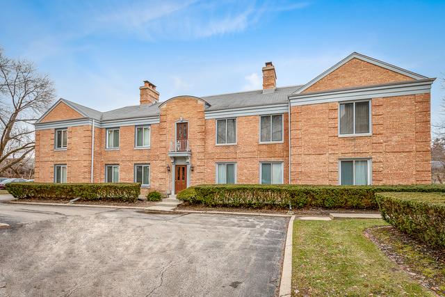 1499 Shermer Rd Unit 204E, Northbrook, IL 60062 - view of front facade with a chimney and brick siding