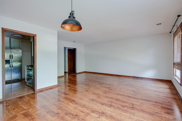 1499 Shermer Rd Unit 204E, Northbrook, IL 60062 - unfurnished room with light wood-type flooring and a barn door