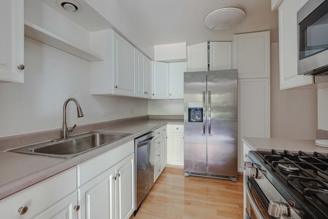 1499 Shermer Rd Unit 204E, Northbrook, IL 60062 - kitchen with stainless steel appliances, white cabinetry, light countertops, and light wood-style floors