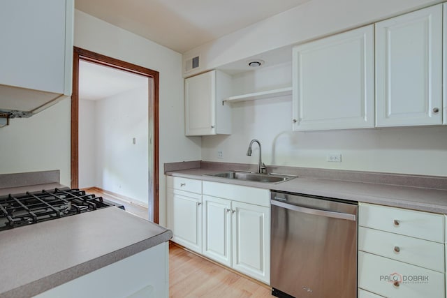 1499 Shermer Rd Unit 204E, Northbrook, IL 60062 - kitchen with dishwasher, open shelves, white cabinets, and light wood finished floors
