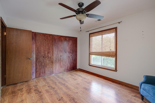 1499 Shermer Rd Unit 204E, Northbrook, IL 60062 - unfurnished bedroom with wood finished floors, a closet, and ceiling fan