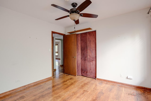 1499 Shermer Rd Unit 204E, Northbrook, IL 60062 - unfurnished bedroom with light wood finished floors, a closet, and a ceiling fan
