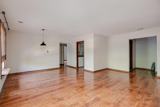 1499 Shermer Rd Unit 204E, Northbrook, IL 60062 - unfurnished room with light wood finished floors and a sink