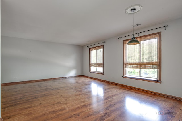 1499 Shermer Rd Unit 204E, Northbrook, IL 60062 - unfurnished room featuring wood finished floors and baseboards