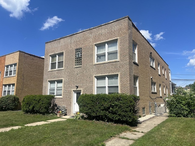 9013 La Crosse Ave, Skokie, IL 60077 - view of front of house featuring brick siding and a front lawn