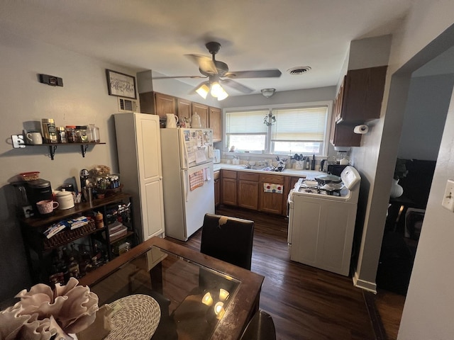 9013 La Crosse Ave, Skokie, IL 60077 - kitchen with white appliances, ceiling fan, brown cabinets, dark wood-type flooring, and light countertops