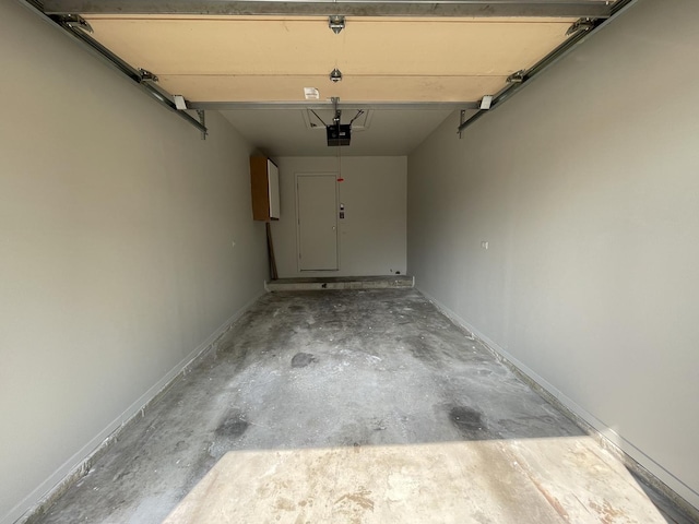 8148 W 111th St Unit C3, Palos Hills, IL 60465 - garage with a garage door opener and baseboards