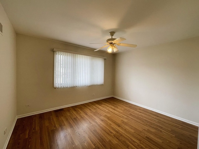 8148 W 111th St Unit C3, Palos Hills, IL 60465 - spare room with a ceiling fan and dark wood-style flooring