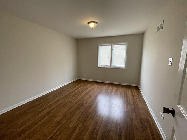 8148 W 111th St Unit C3, Palos Hills, IL 60465 - empty room with dark wood-style floors and baseboards