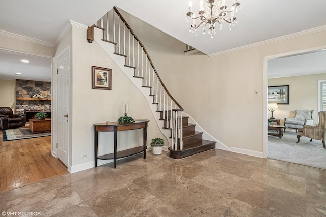 195 Cold Spring Rd, Barrington, IL 60010 - stairs featuring ornamental molding, a stone fireplace, and a chandelier