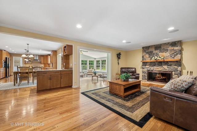 195 Cold Spring Rd, Barrington, IL 60010 - living area featuring light wood-type flooring, a fireplace, crown molding, a chandelier, and recessed lighting
