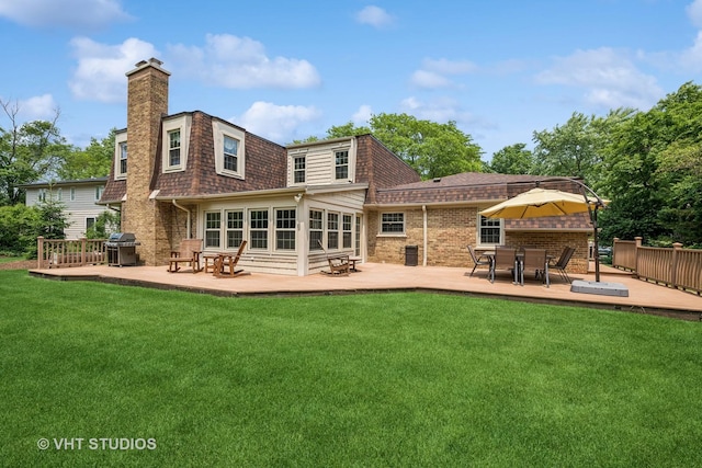 195 Cold Spring Rd, Barrington, IL 60010 - rear view of property featuring a chimney, a lawn, a wooden deck, and brick siding
