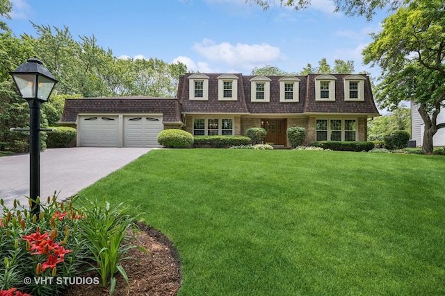 195 Cold Spring Rd, Barrington, IL 60010 - view of front facade featuring mansard roof, a garage, concrete driveway, and a front lawn