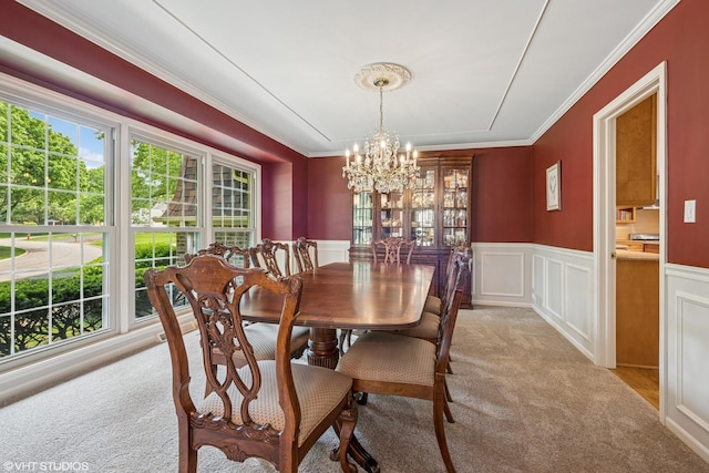 195 Cold Spring Rd, Barrington, IL 60010 - dining space with carpet floors, a chandelier, crown molding, a wainscoted wall, and a decorative wall