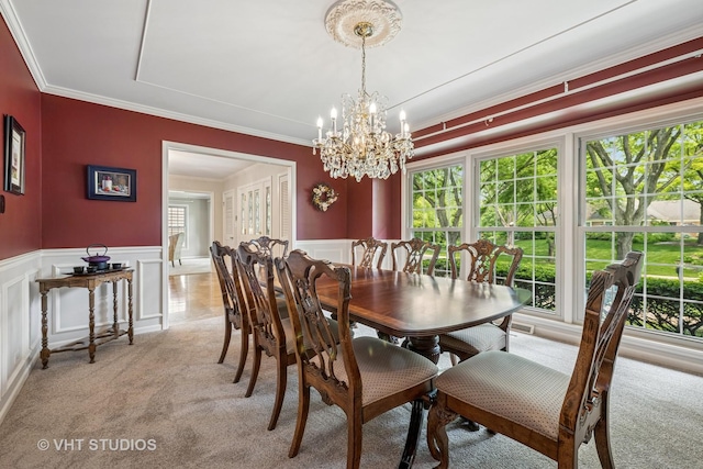 195 Cold Spring Rd, Barrington, IL 60010 - dining space with light colored carpet, healthy amount of natural light, crown molding, a chandelier, and a decorative wall