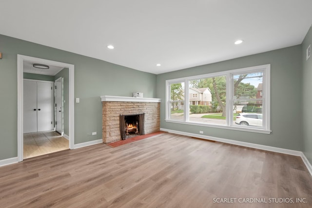 944 S Harvard Ave, Villa Park, IL 60181 - unfurnished living room with wood finished floors, a fireplace, and recessed lighting